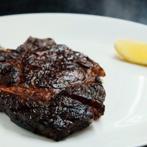Have a cow: Rib-eye steak on the bone at Rockpool Bar & Grill. Photo: Christopher Pearce