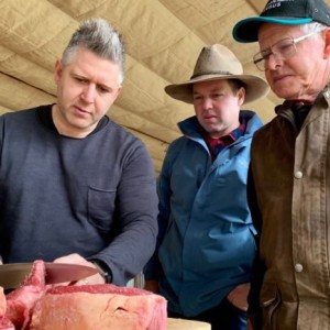 Chef Massimo Mele educates Nelson and Donald Bonney on how he prepares their meat.
